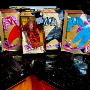 SET OF  VINTAGE  1991 MC HAMMER & 3 sets of clothing in packaging.